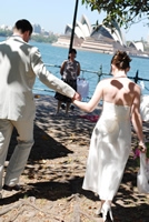 Happy couple with Sydney Opera House in background.